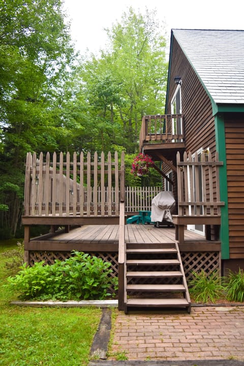 The large, private deck with gas grill is close to the kitchen/dining area.