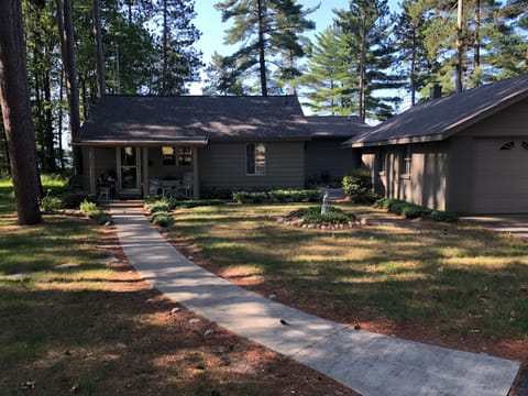 Home is set back from the main road, at the end of a long circle asphalt drive.