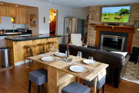 Living room with dining table set for four