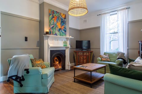 Sitting room with open fire for cosy winter nights.  Reverse cycle air con also