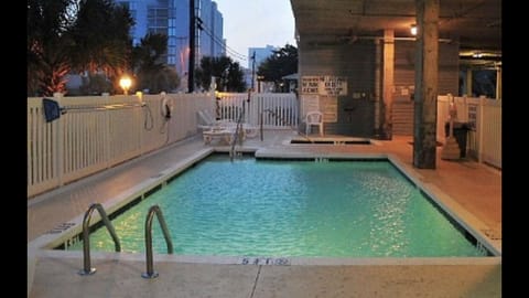 Beautiful pool and hot tub to enjoy after a day on the beach. 