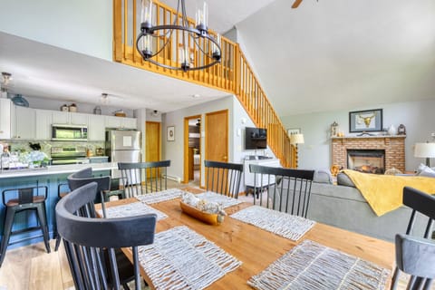 Open floor plan living/dining/kitchen with access to primary bedroom & bathroom