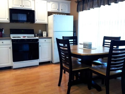 The kitchen table has a butterfly leaf that expands to accommodate 6.