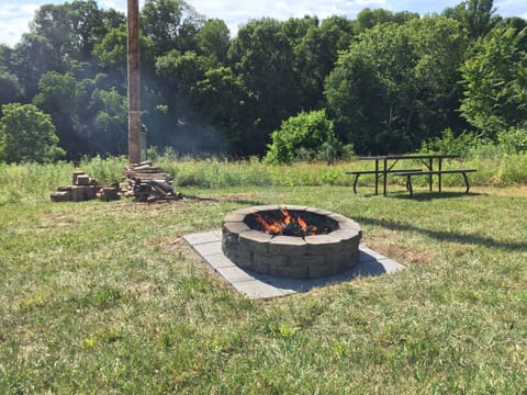 Picnic area, grill hangs on pole