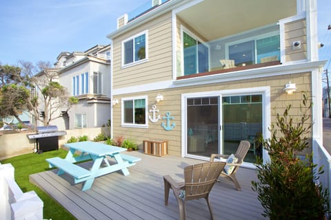 Large patio with BBQ and table, one house off the ocean