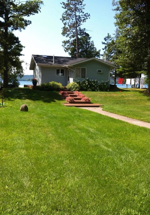 The view of our home from  across our lush, barefoot lawn.