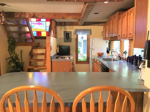 Kitchen area with breakfast bar.
