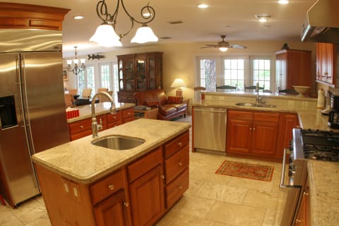 A view of the kitchen--- equipped with marble counters and all premium appliance