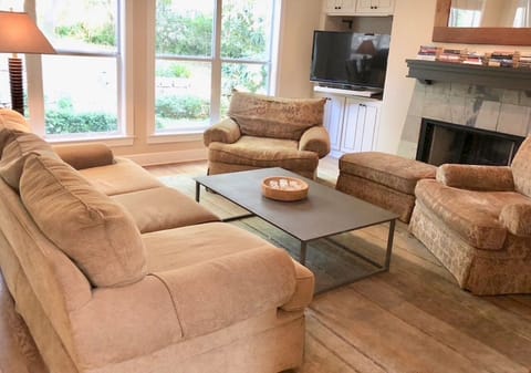 Downstairs living room with super comfy sofas and chairs (and throw blankets!)