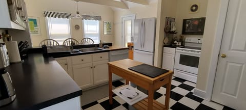 Kitchen fully equipped with island on wheels