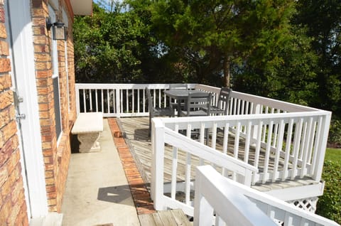 "What happens on the porch...."  Great pub table and chairs to enjoy sun and fun.