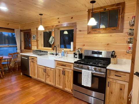 Remodeled kitchen with dishwasher and farmhouse sink