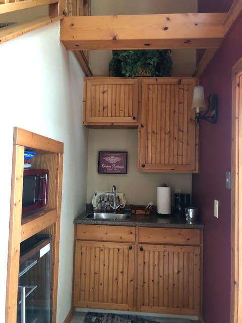 Kitchenette with microwave and beverage refrigerator
