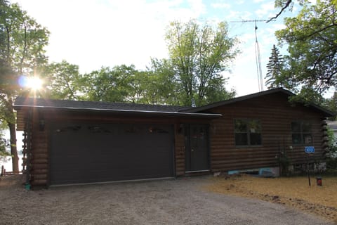 Front of house.  There is now a concrete driveway with stone parking slab area.