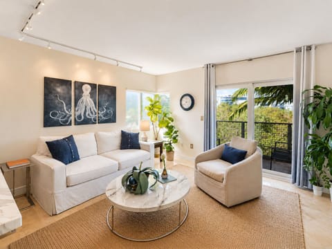 Slide the balcony door open, relax on the couch, and keep drinks on the table.