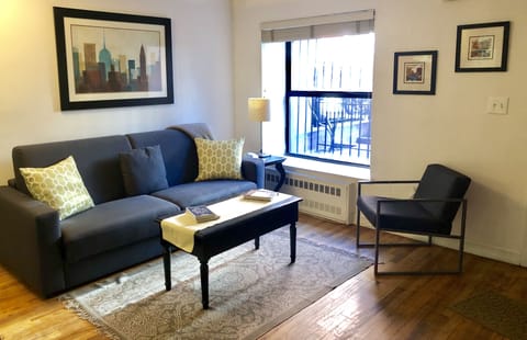 Living Room w/lots of natural light & Italian luxury sofabed with Queen mattress