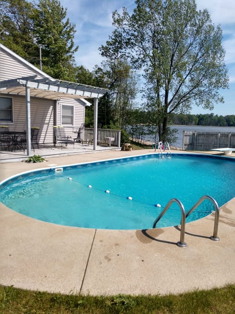 Inground pool 16x32 with pergola and grassy yard overlooking Fox Lake