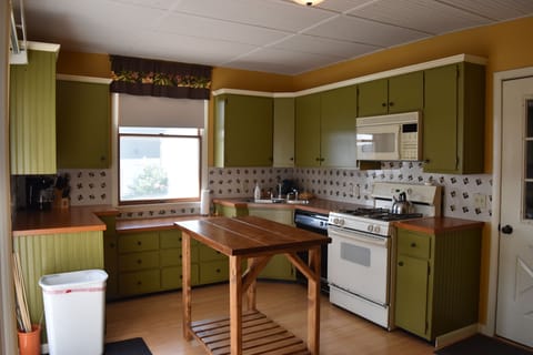 Kitchen with new rustic island...microwave, dishwasher, toaster, coffee maker...