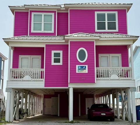 Front of house by the street.