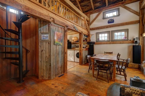 Dining area with kitchen to the left.