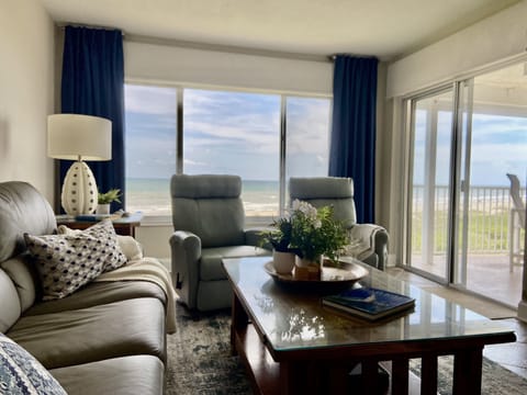 Living Area with Direct Ocean View. There are two leather recliner swivel chairs