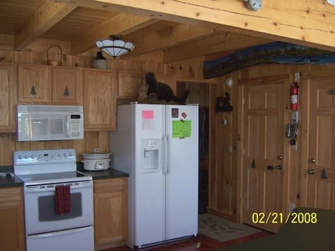 Kitchen has all amenities needed.