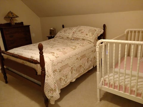 Full bedroom with crib (and an additional pack and play) on second floor