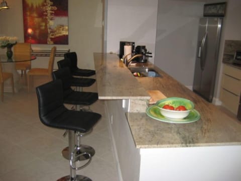 Bar with adjustable bar stools. the bar is 9 feet long 16' wide