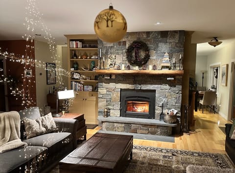 Curl up on the sectional w/ stone wood burning firelplace and cross valley views