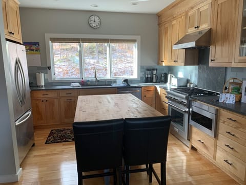 New kitchen, granite counter, butcher block island with ample seating