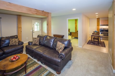 Den, lower level, sofa and loveseat with TV & DirectTV satellite