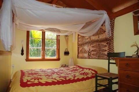 Bedroom with queen and single bed.