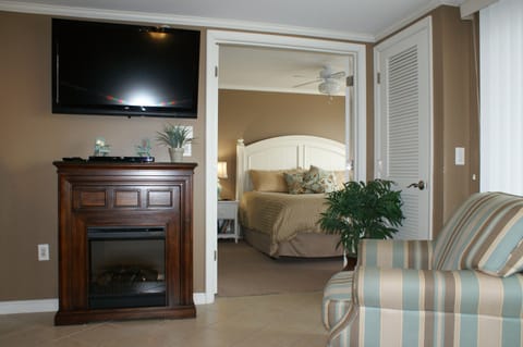 Living Area w/ Cozy Fireplace & Big Screen LCD TV