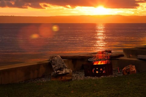 Toasting the sunset with friends & family at the beachside firepit.