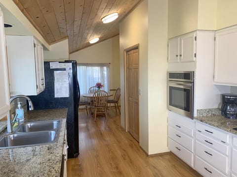 Looking through the kitchen to the sunny breakfast room