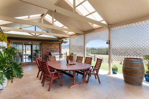 Entertainment Area with 10 seater BBQ setting, 4 burner gas bbq & drink fridge.
