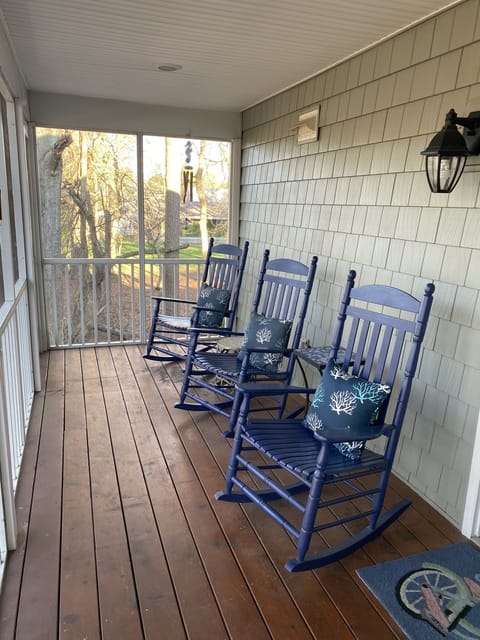 Screen porch on 2nd floor, access from kitchen, overlooks backyard