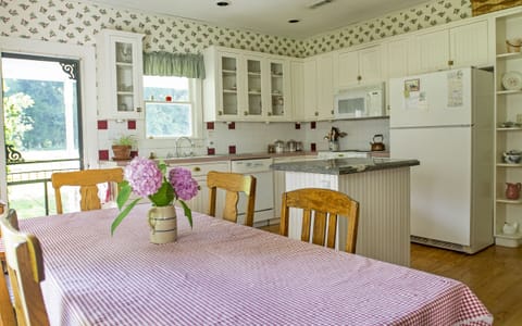 The kitchen table seats six to eight