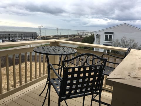 Outside Deck, high top table & chairs to watch sunset.Chair cushions inside unit
