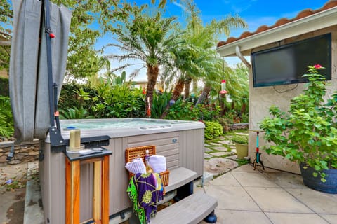 Hot tub garden area with flat screen TV. Watch a movie, catch up on news, relax