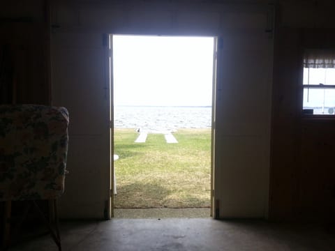Garage doors opening on the lakeside.  