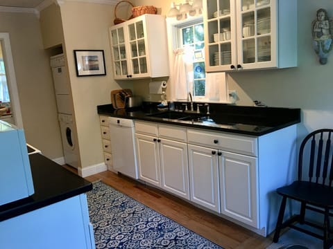 Fully equipped eat-in kitchen with granite countertops and new Bosch dishwasher 