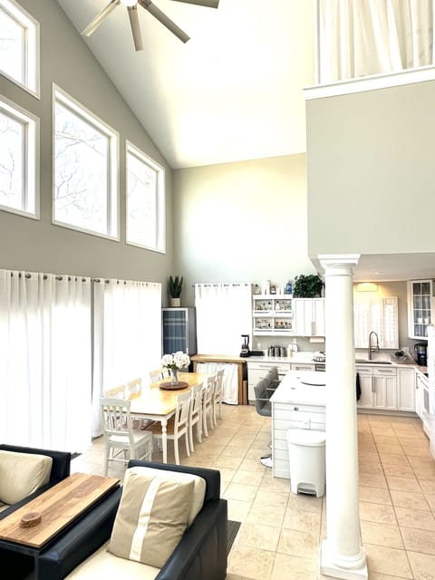 Seating for all your guests in the kitchen + 102 bottle/100 can refrigerator 