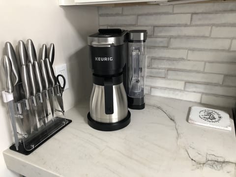 Keurig coffee maker will make a regular pot too.  Bring pods if you like.