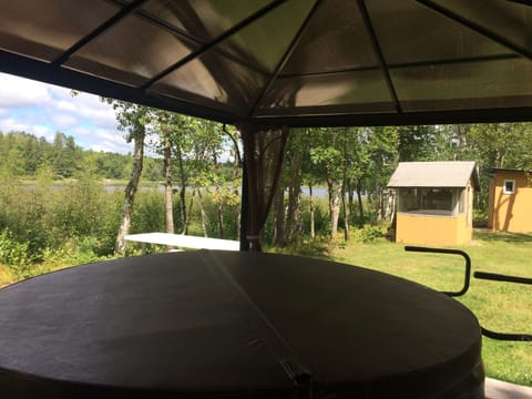 Hot tub. Lake is in the background. 
