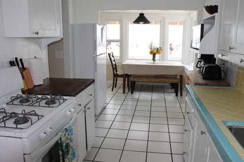 Kitchen table faces the boardwalk and beach.