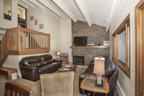 Living Room with view of stairs up to loft, bunk beds and second Master Suite