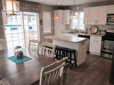 Kitchen with island and table
