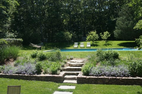 garden of lavender, thyme, herbs and flowers. Apple/ Pear trees back woods.