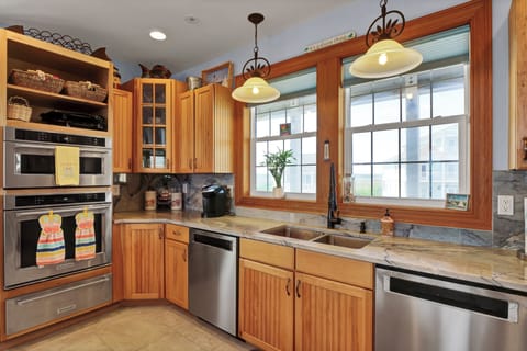 Kitchen with two dishwashers, two ovens and microwave.